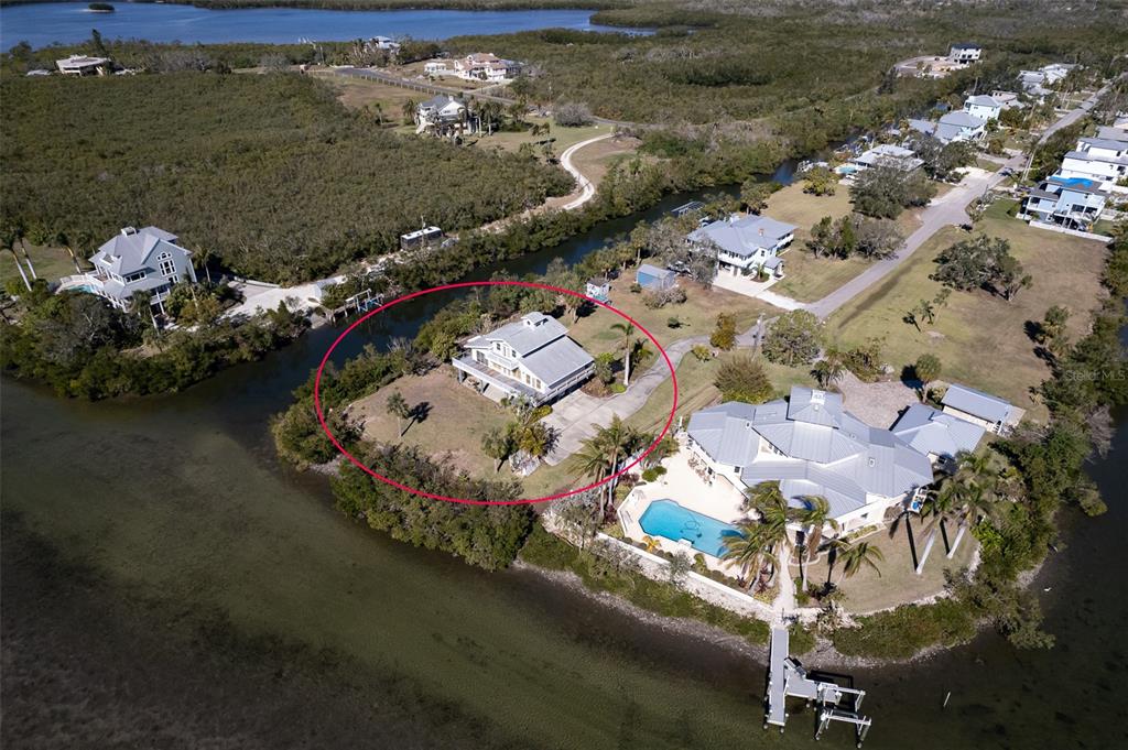 145 Burns Road Terra Ceia, FL 34250 - Photo 7 of 65 an aerial view of a house with a lake view