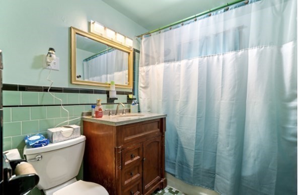 15 Oak Road Medford, MA 02155 - Photo 12 of 18 a bathroom with a toilet sink and mirror