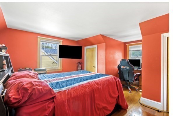 15 Oak Road Medford, MA 02155 - Photo 17 of 18 a bedroom with a bed and wooden floor