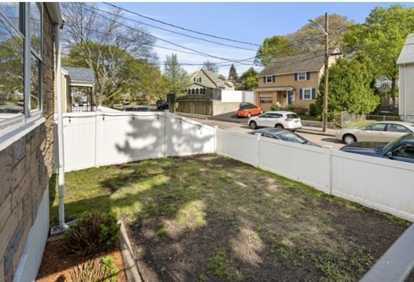 15 Oak Road Medford, MA 02155 - Photo 18 of 18 a swimming pool with outdoor seating and yard