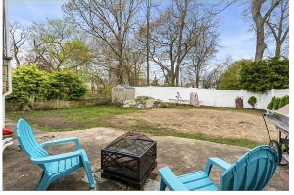 15 Oak Road Medford, MA 02155 - Photo 3 of 18 a view of backyard with seating area and green space