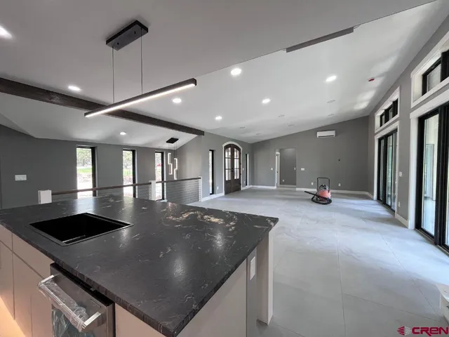 a kitchen with a stove and a refrigerator