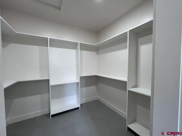 a view of a room with large windows