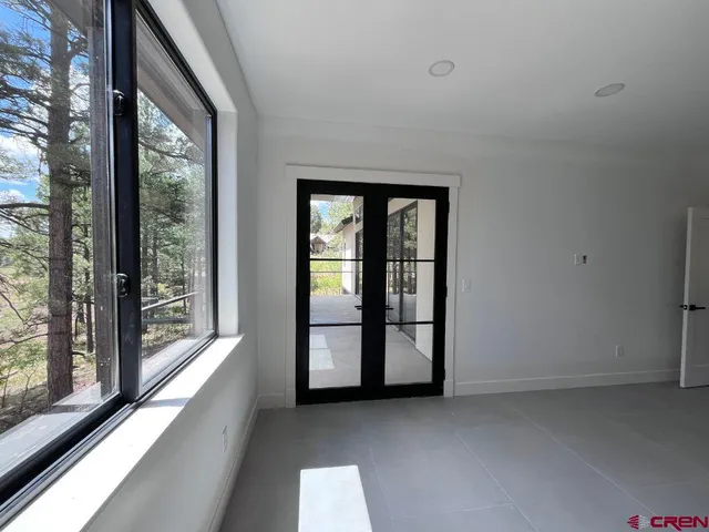 a view of an empty room with a balcony