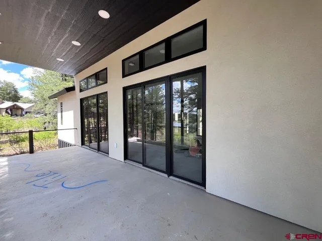 a view of swimming pool with a patio and backyard