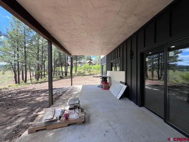 a view of a yard with a tree