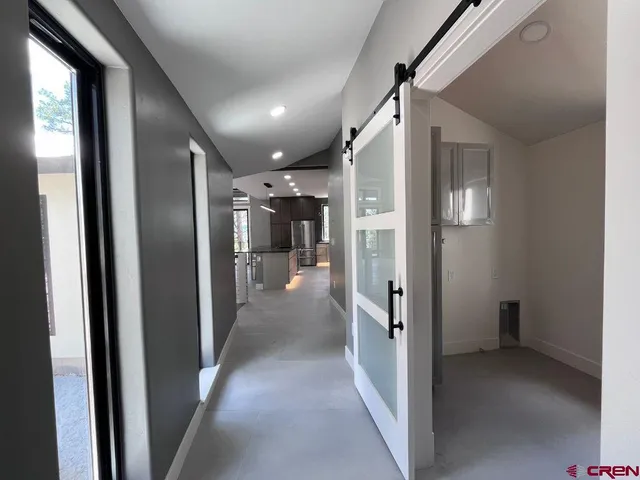 a view of a room that has a window in it