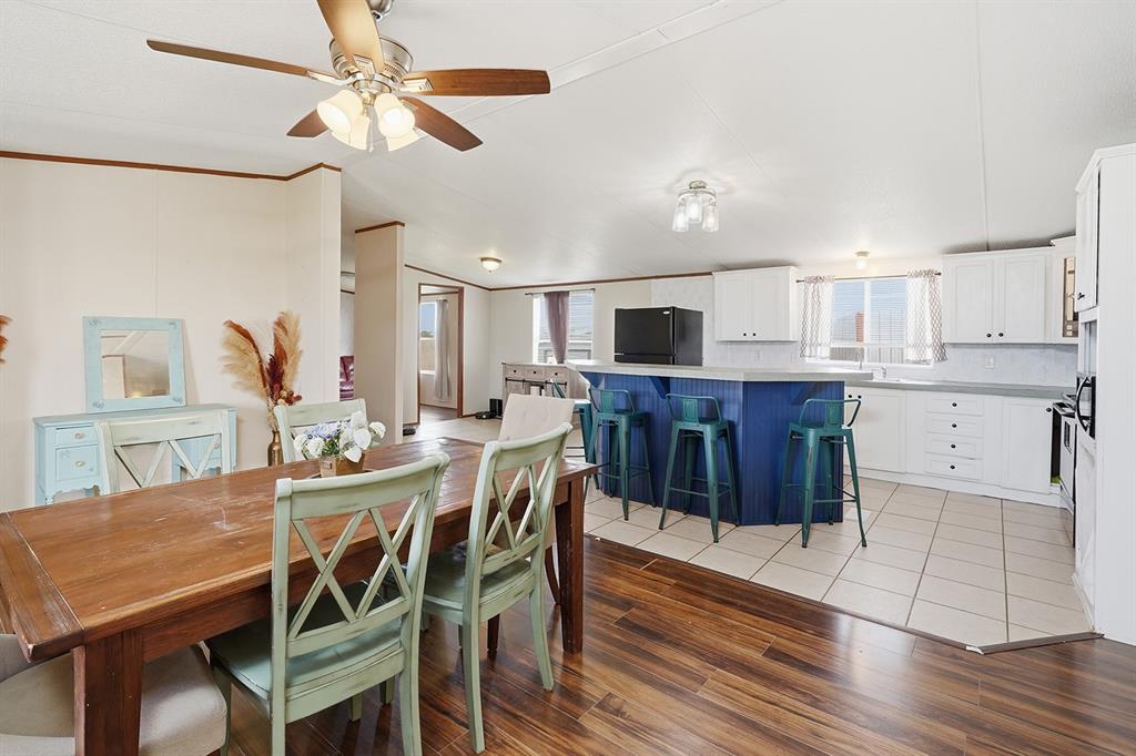 2538 County Road 2320 Decatur, TX 76234 - Photo 12 of 40 a view of a dining room with furniture and wooden floor
