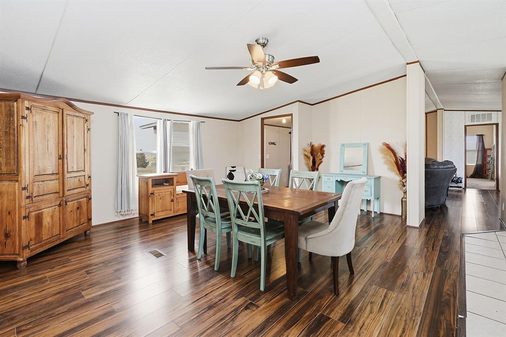 2538 County Road 2320 Decatur, TX 76234 - Photo 13 of 40 a view of a a dining room with furniture window and wooden floor