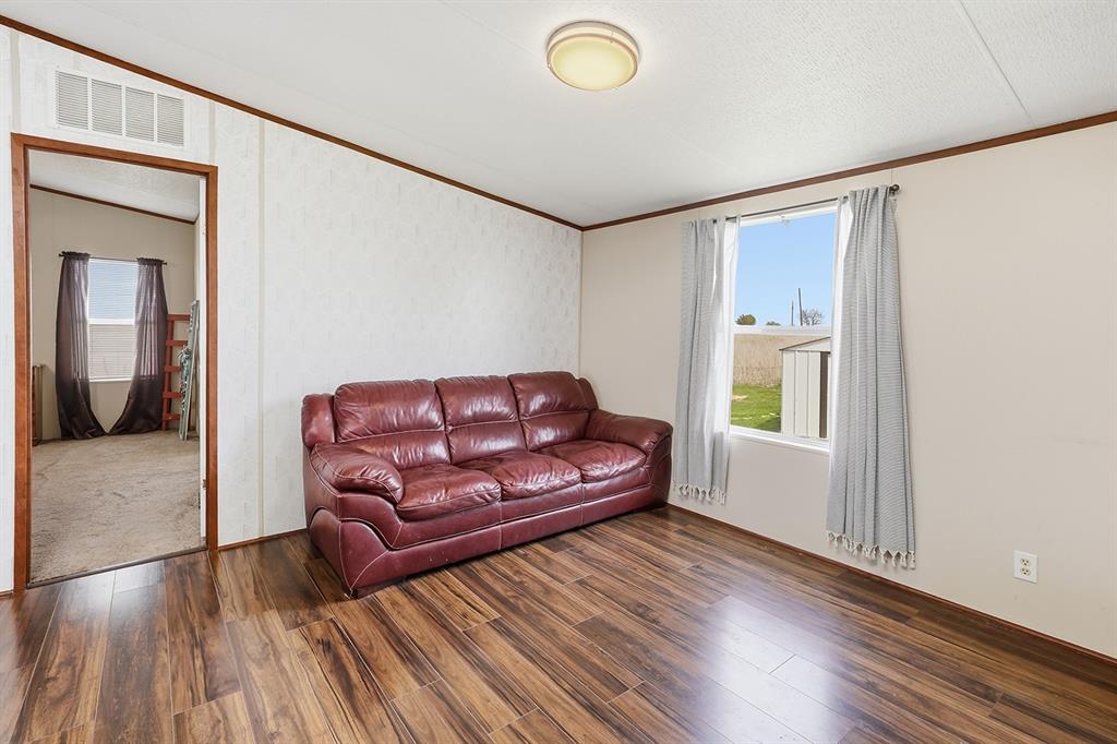 2538 County Road 2320 Decatur, TX 76234 - Photo 15 of 40 a living room with furniture and a wooden floor