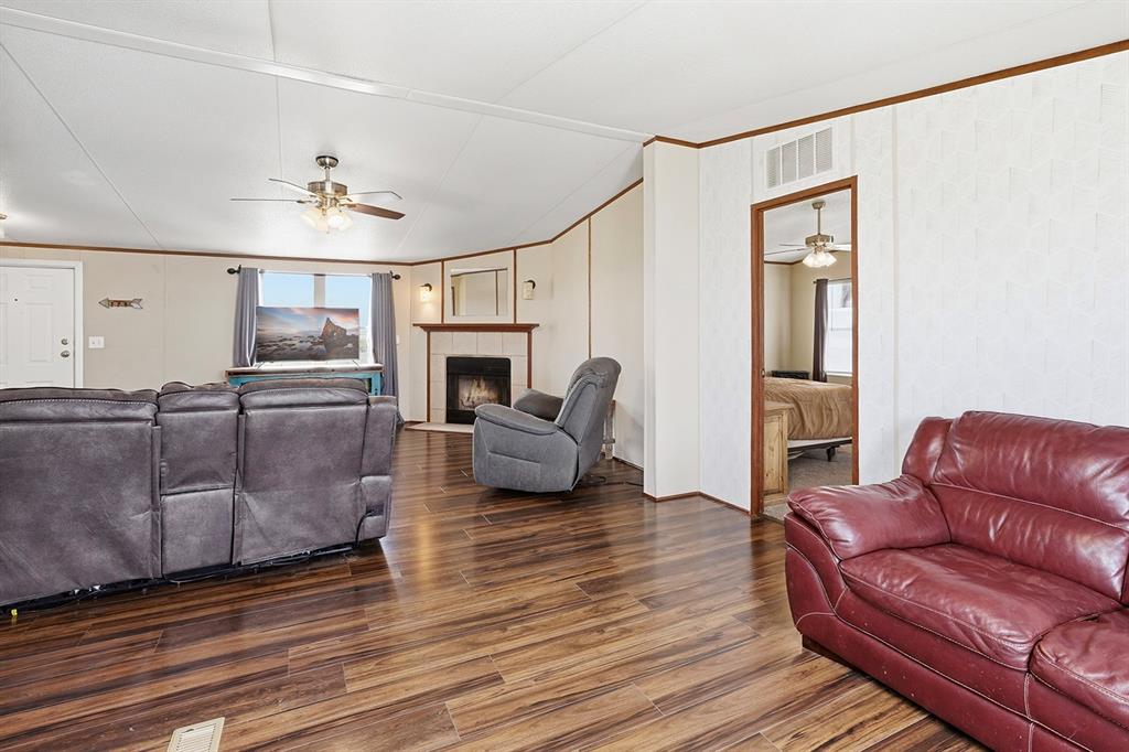 2538 County Road 2320 Decatur, TX 76234 - Photo 16 of 40 a living room with furniture or couch and a fireplace