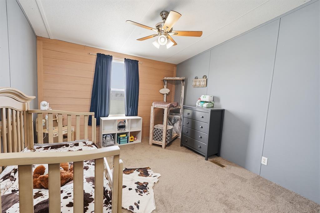 2538 County Road 2320 Decatur, TX 76234 - Photo 25 of 40 a living room with furniture a fireplace and a chandelier