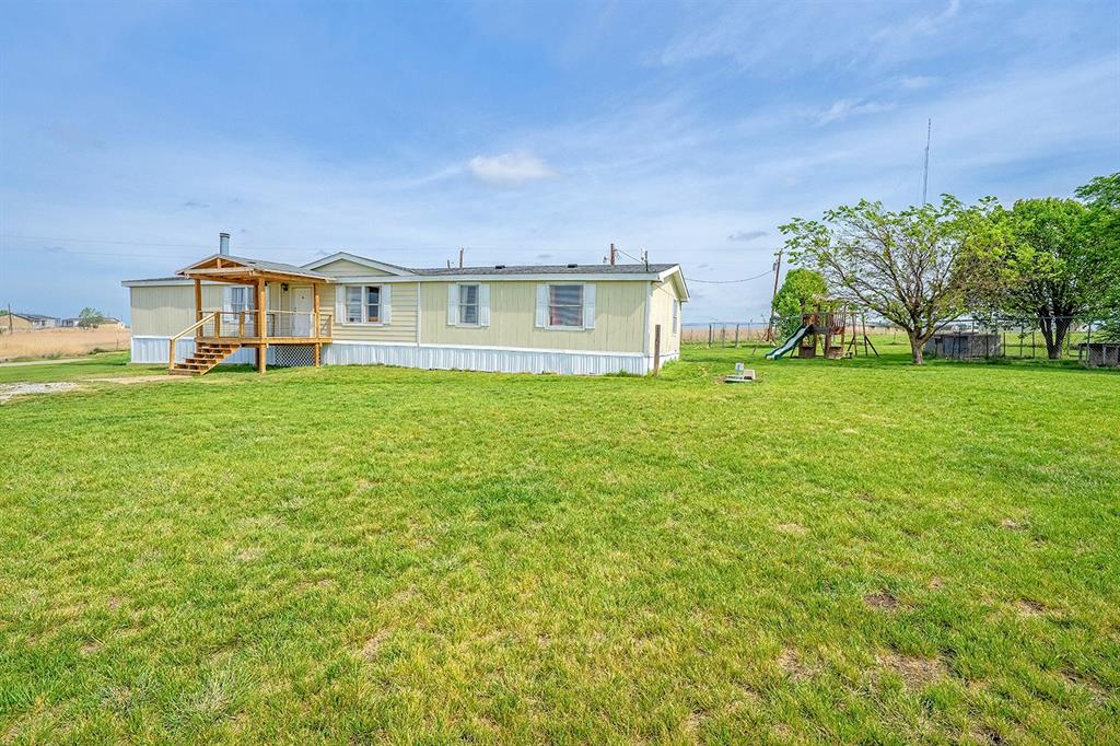 2538 County Road 2320 Decatur, TX 76234 - Photo 34 of 40 a view of a house with a big yard and large trees