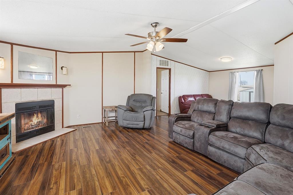 2538 County Road 2320 Decatur, TX 76234 - Photo 4 of 40 a living room with furniture and a fireplace