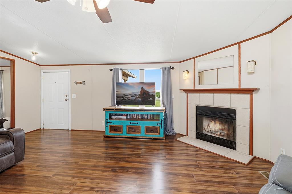 2538 County Road 2320 Decatur, TX 76234 - Photo 5 of 40 a living room with furniture and a fireplace