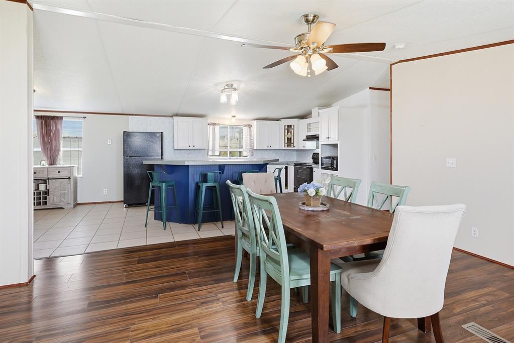 2538 County Road 2320 Decatur, TX 76234 - Photo 7 of 40 a view of a dining room with furniture and wooden floor