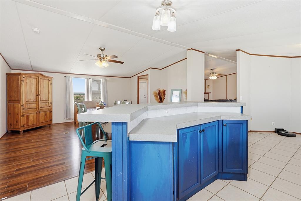 2538 County Road 2320 Decatur, TX 76234 - Photo 9 of 40 a kitchen with granite countertop a sink cabinets and wooden floor