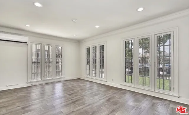 a view of entryway with wooden floor