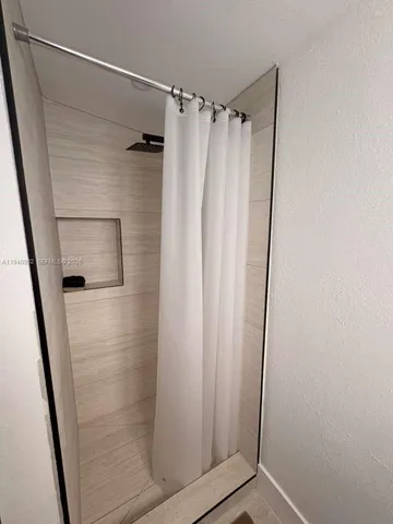 a bathroom with a shower and a tub