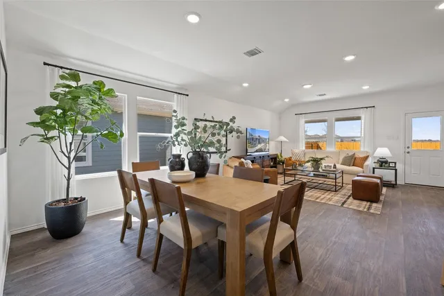 a view of living room with granite countertop furniture and wooden floor