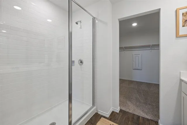 a bathroom with a bathtub and shower