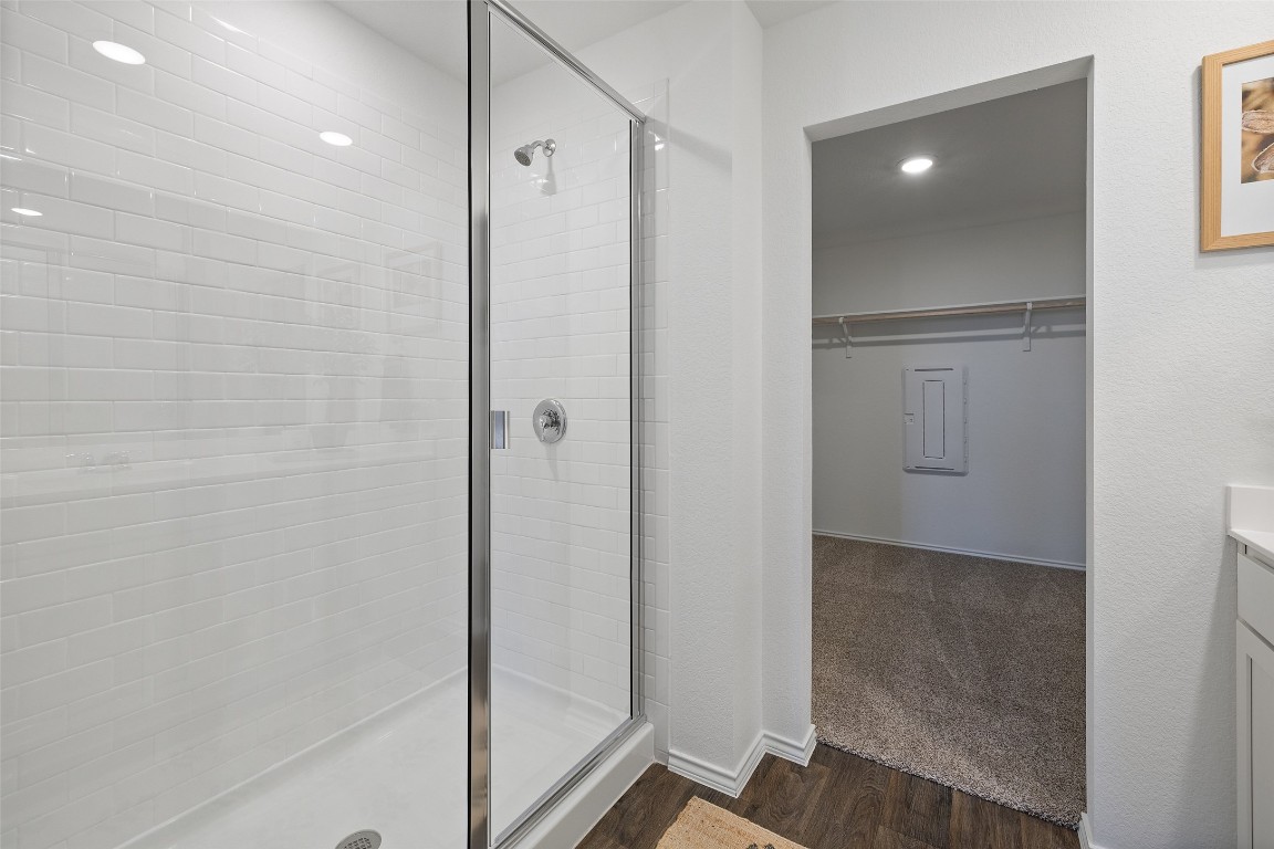 173 Balmorhea Street Kyle, TX 78640 - Photo 26 of 29 a bathroom with a shower and a glass door