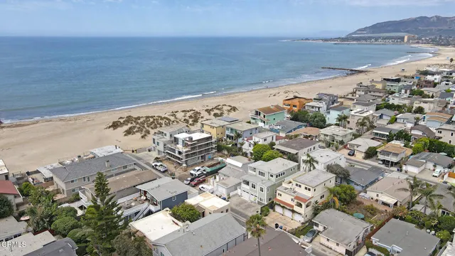 an aerial view of beach and ocean