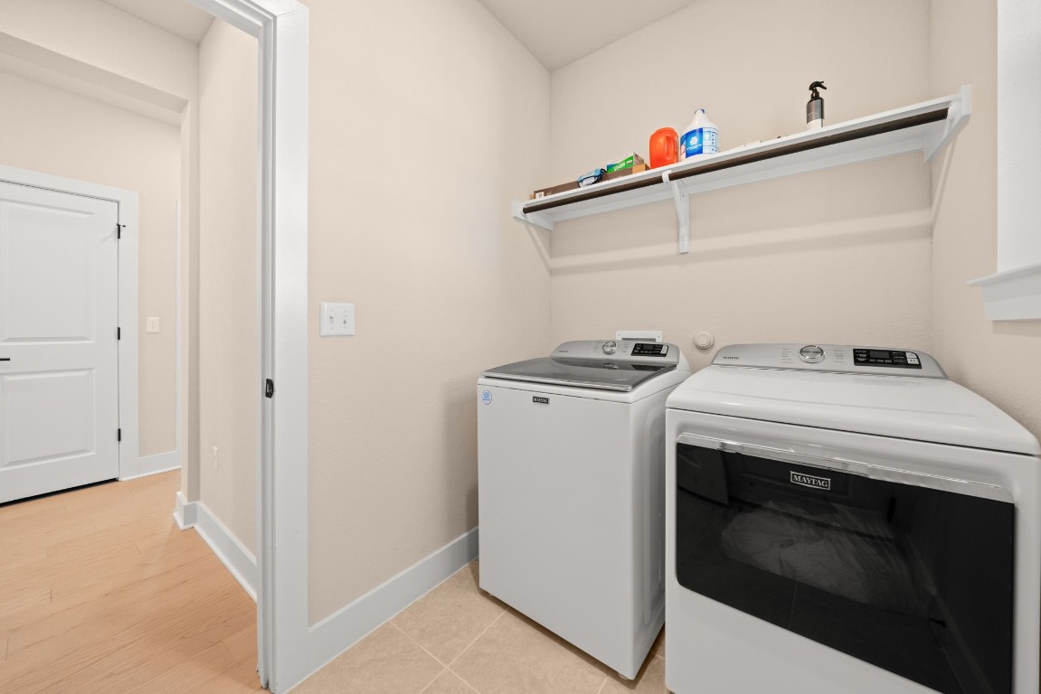 8417 Laughlin Lane Austin, TX 78744 - Photo 12 of 38 a utility room with dryer and washer