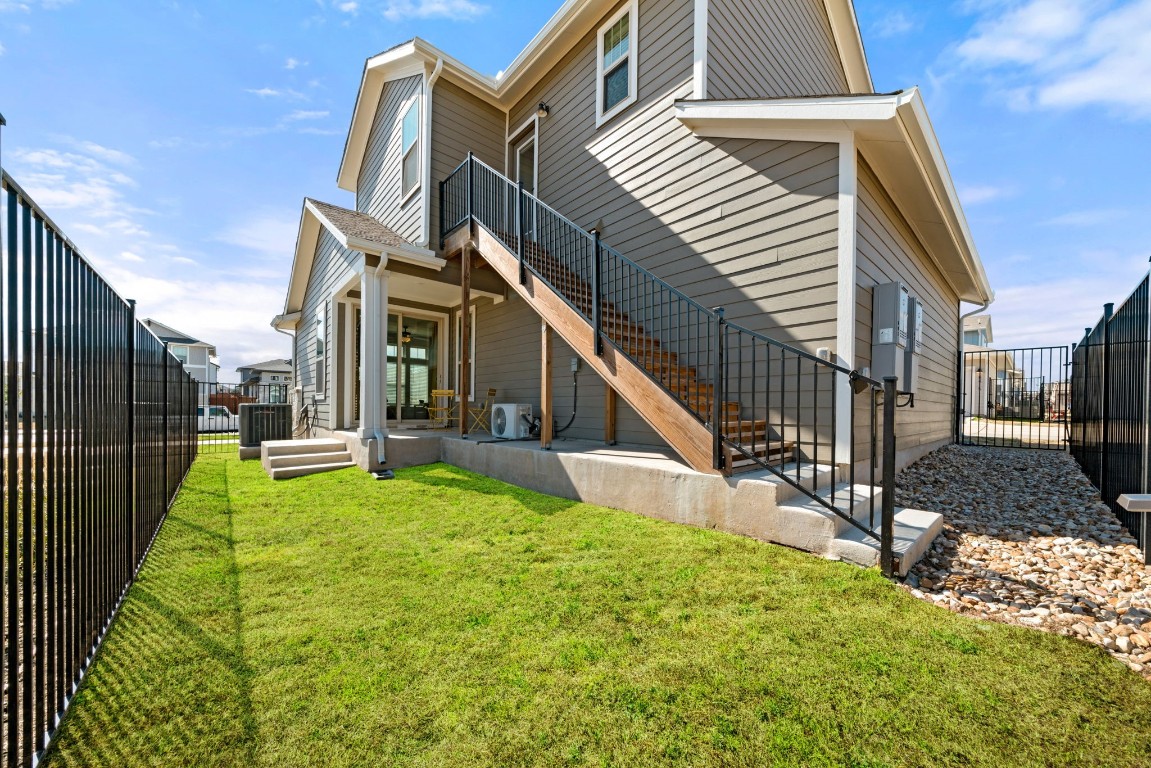 8417 Laughlin Lane Austin, TX 78744 - Photo 25 of 38 a view of a house with backyard and porch