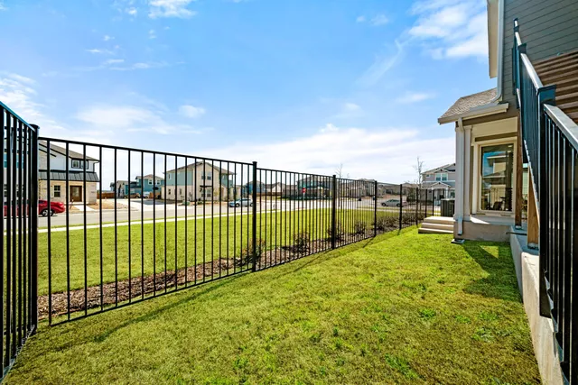 a balcony with a couch and chairs