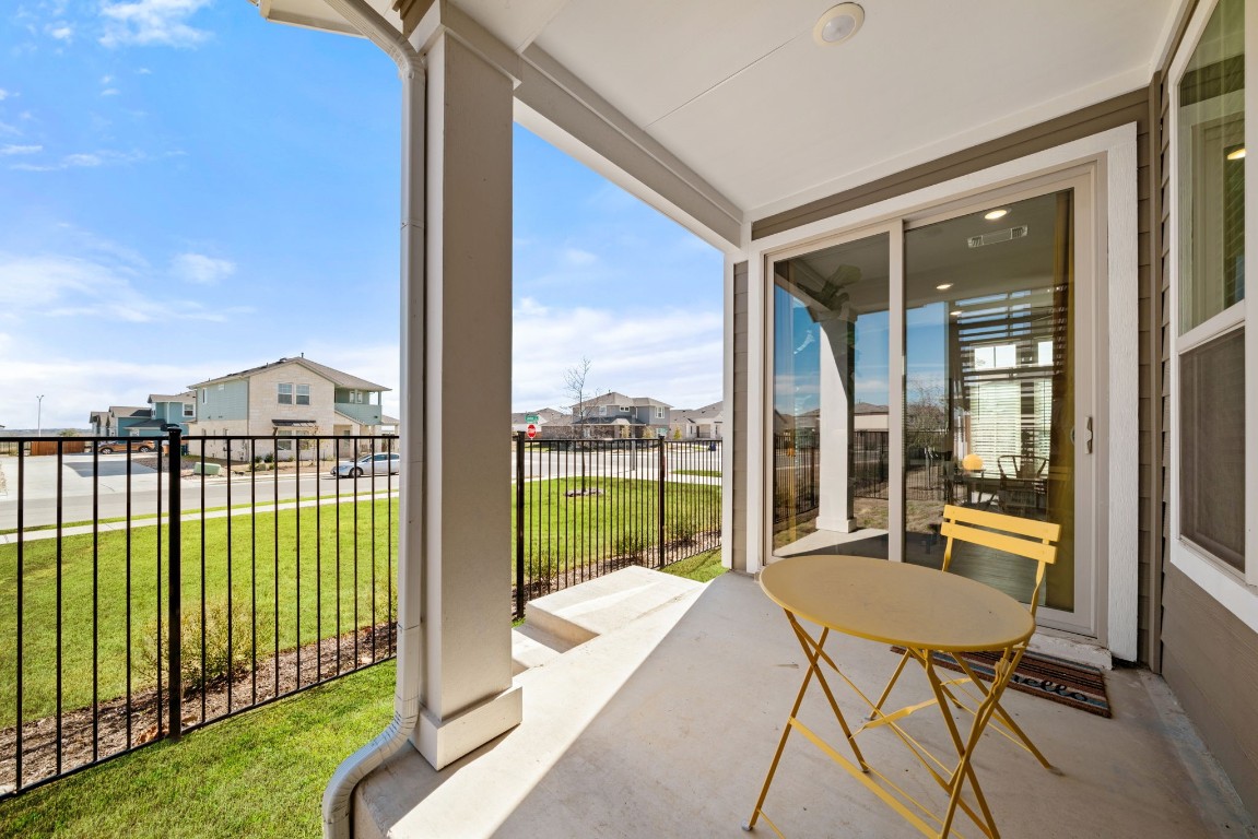8417 Laughlin Lane Austin, TX 78744 - Photo 27 of 38 a balcony with a couch and chairs
