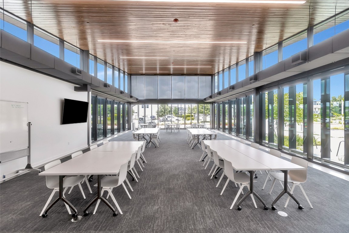 8417 Laughlin Lane Austin, TX 78744 - Photo 37 of 38 a dining room with furniture and a floor to ceiling window