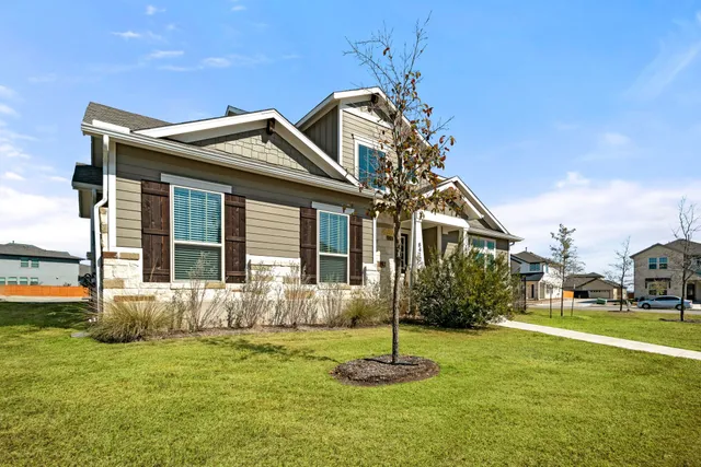a front view of a house with a yard