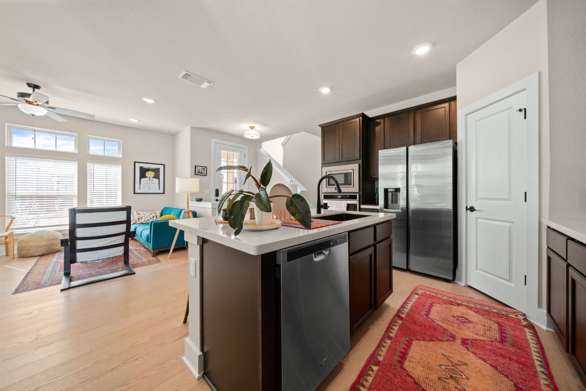 8417 Laughlin Lane Austin, TX 78744 - Photo 6 of 38 a kitchen with counter top space with stainless steel appliances lots of counter top space