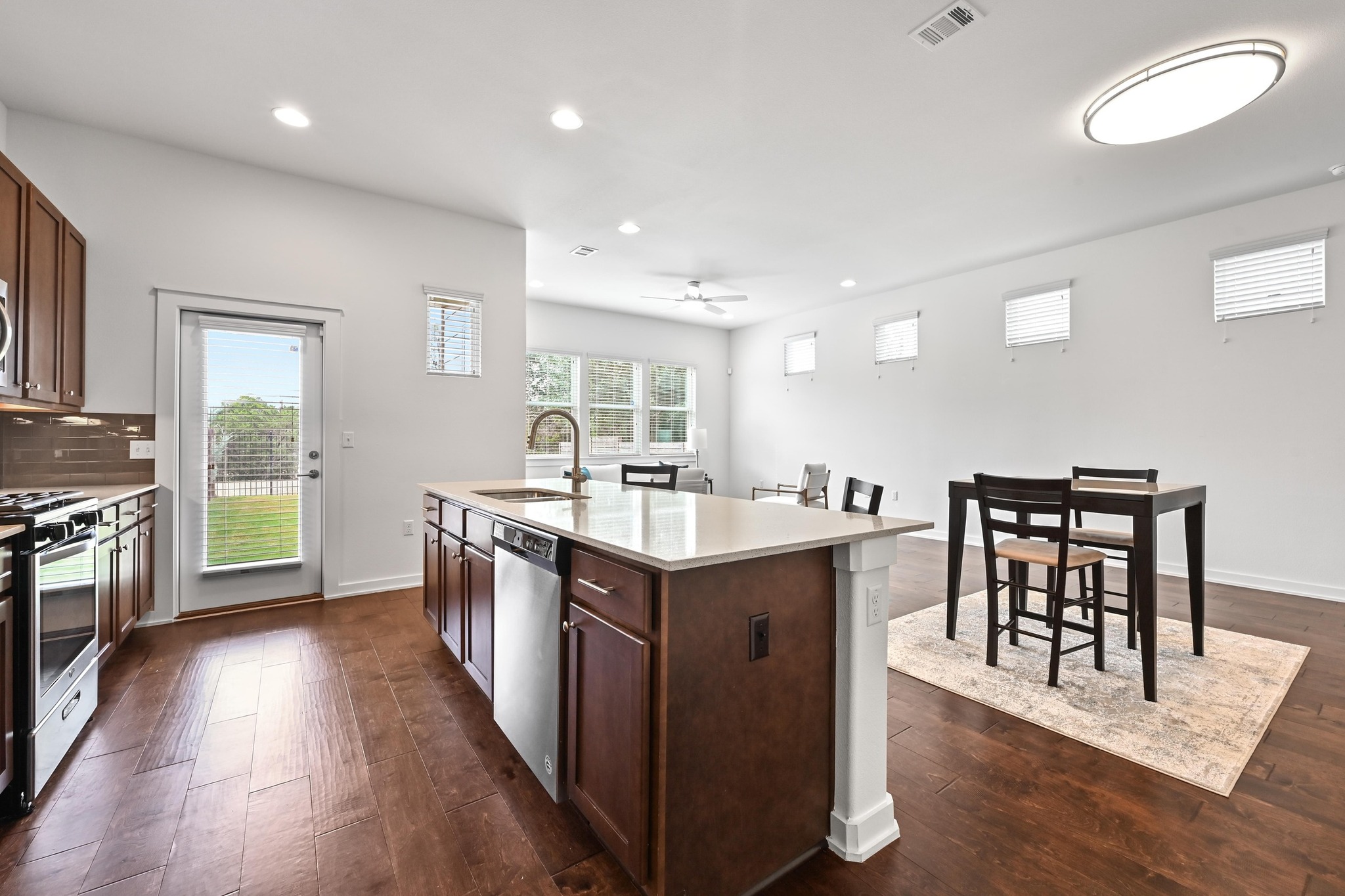 8901 Parker Ranch Circle, Unit A Austin, TX 78748 - Photo 13 of 31 Gleaming hardwood floors and a spacious central island anchor this open-concept layout.