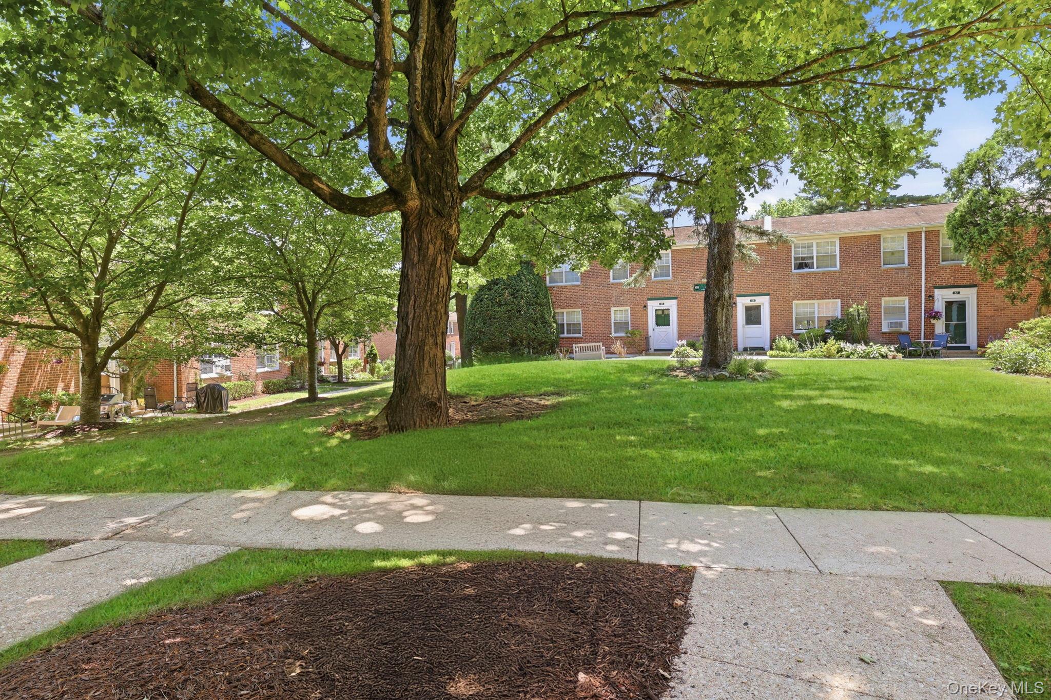 186 Pinewood Road, Unit 56 Hartsdale, NY 10530 - Photo 21 of 29 Right outside your front door is space for your table/chairs/BBQ grille and maybe some flower pots