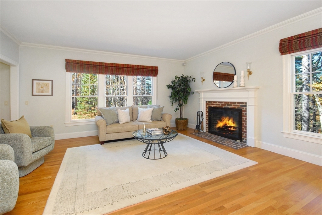 96 Forest Ridge Road, Unit 96 Concord, MA 01742 - Photo 11 of 36 a living room with furniture and a fireplace