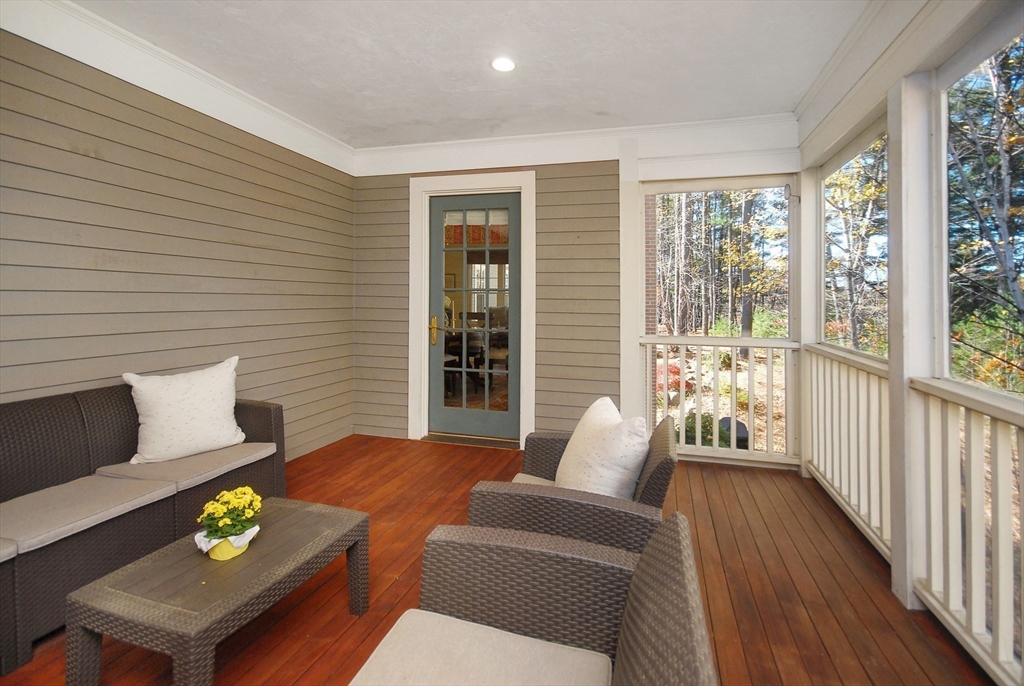 96 Forest Ridge Road, Unit 96 Concord, MA 01742 - Photo 16 of 36 a living room with furniture and a window