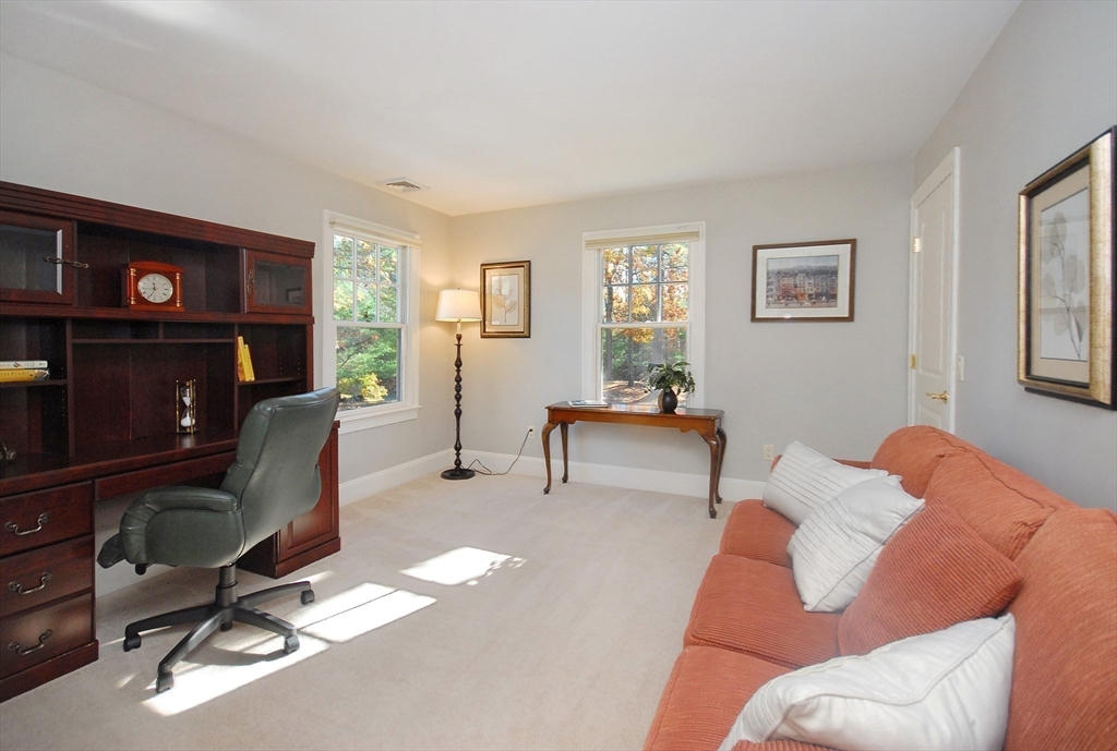 96 Forest Ridge Road, Unit 96 Concord, MA 01742 - Photo 22 of 36 a view of a livingroom with workspace and a couch