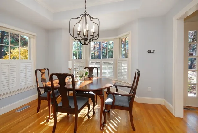 a view of a dining room with furniture and a window