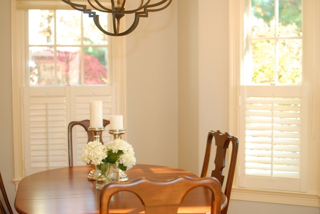 96 Forest Ridge Road, Unit 96 Concord, MA 01742 - Photo 9 of 36 a view of a dining room with furniture and a window