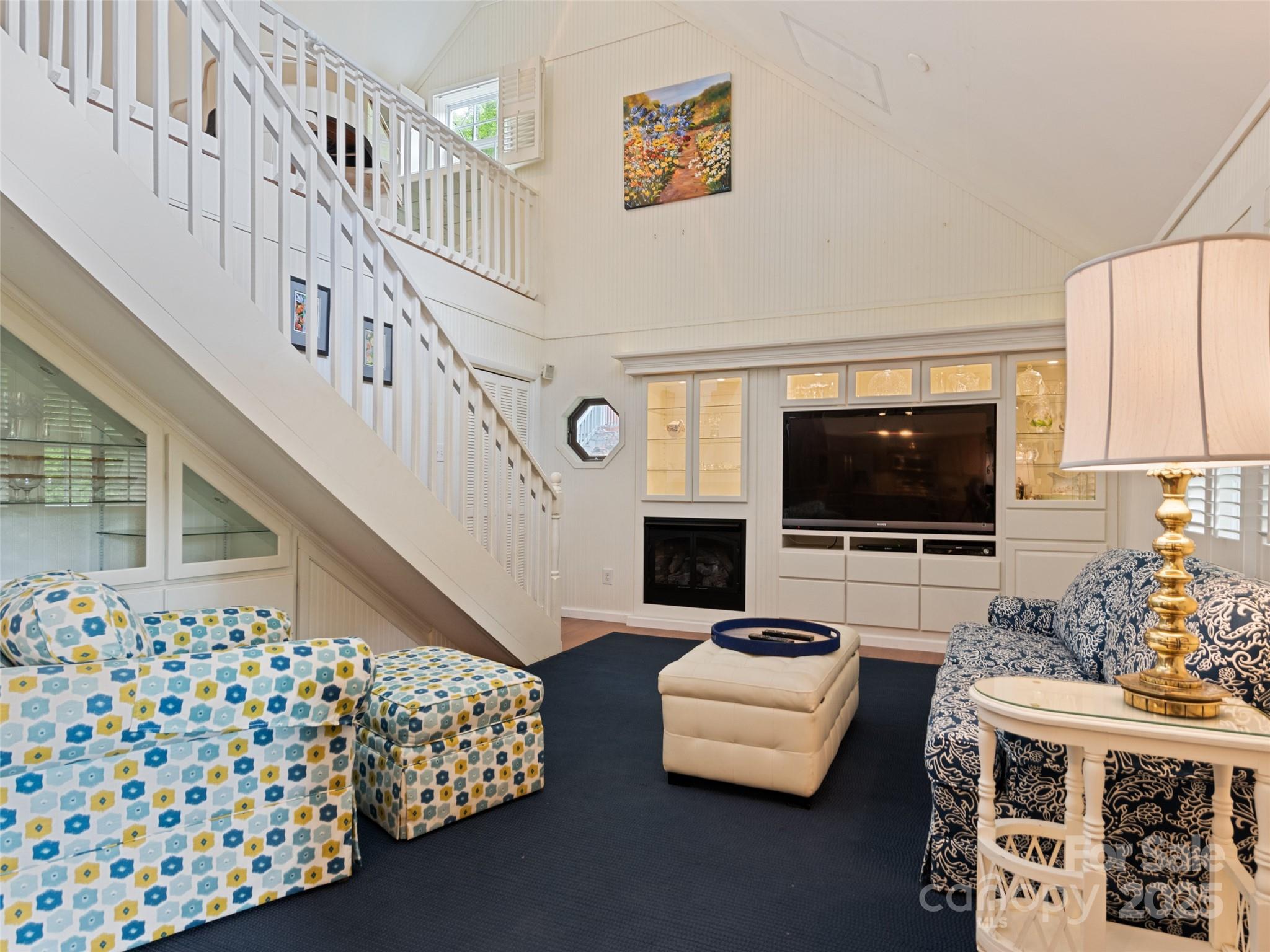 195 Three Springs Drive Sylva, NC 28779 - Photo 19 of 48 a living room with furniture and a flat screen tv