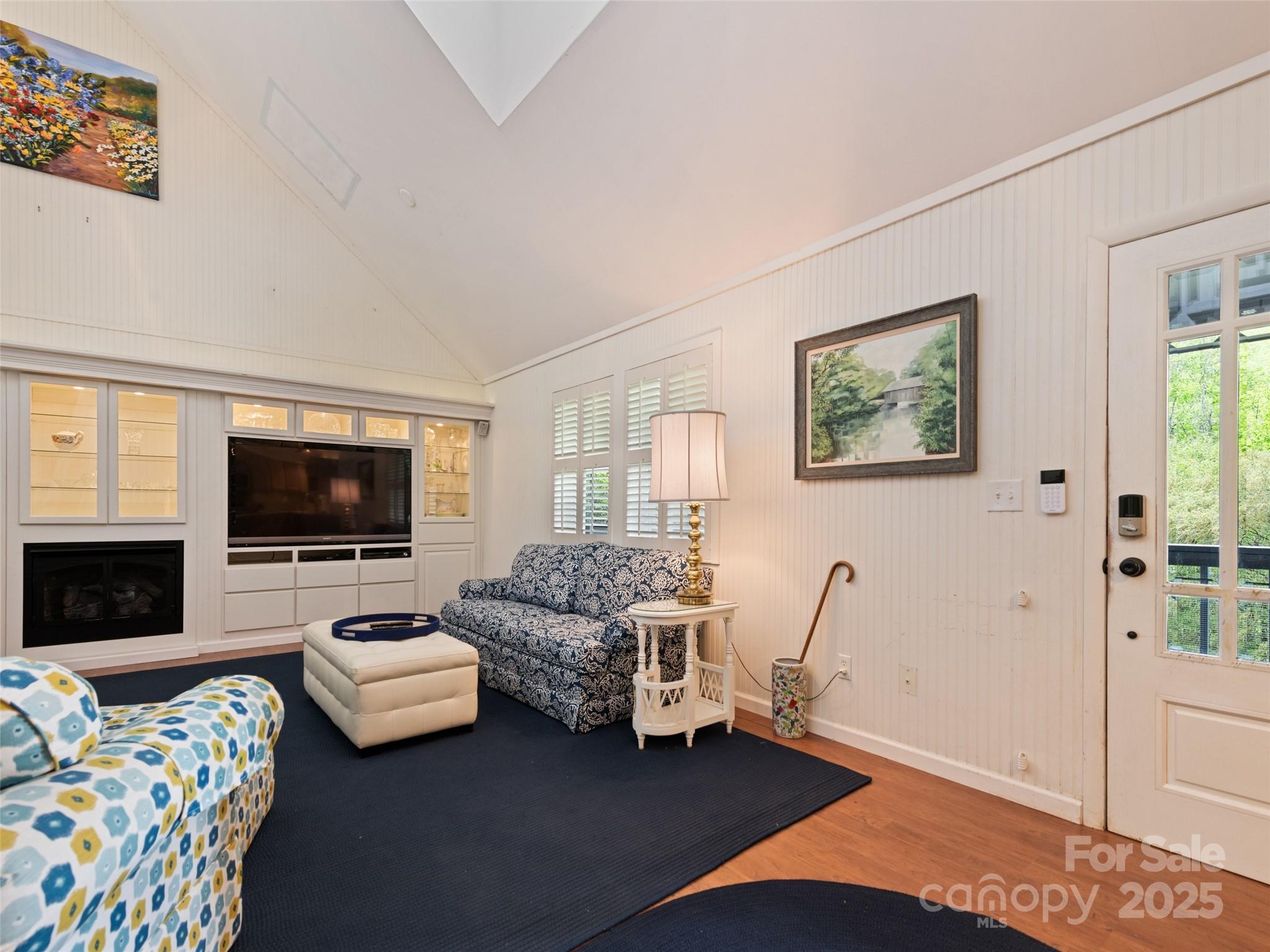 195 Three Springs Drive Sylva, NC 28779 - Photo 20 of 48 a living room with furniture and a flat screen tv