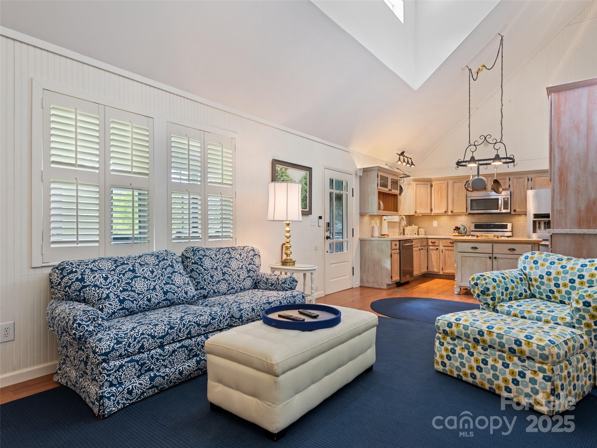 195 Three Springs Drive Sylva, NC 28779 - Photo 21 of 48 a living room with furniture a couch and a chandelier