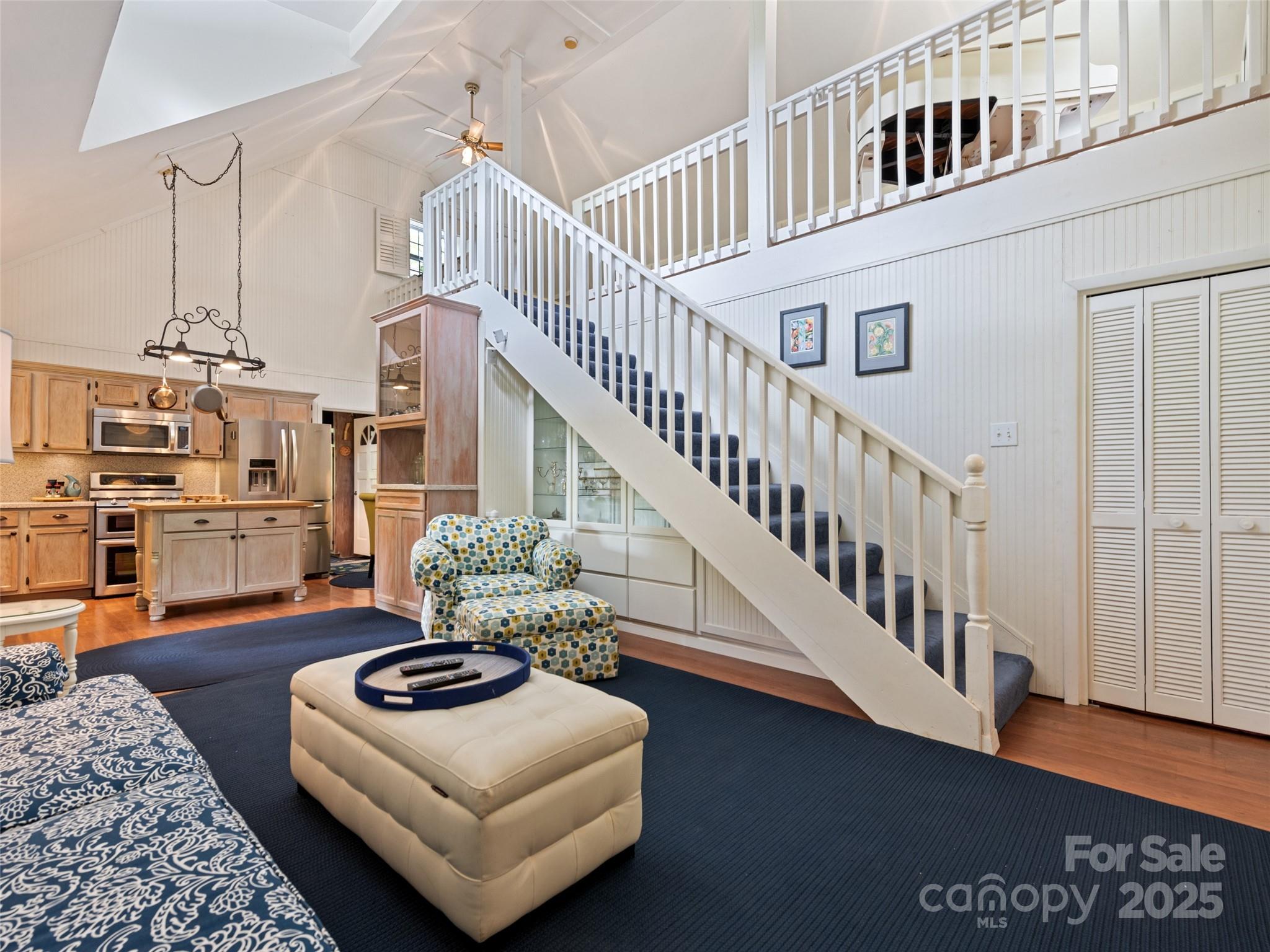 195 Three Springs Drive Sylva, NC 28779 - Photo 22 of 48 a living room with furniture and wooden floor