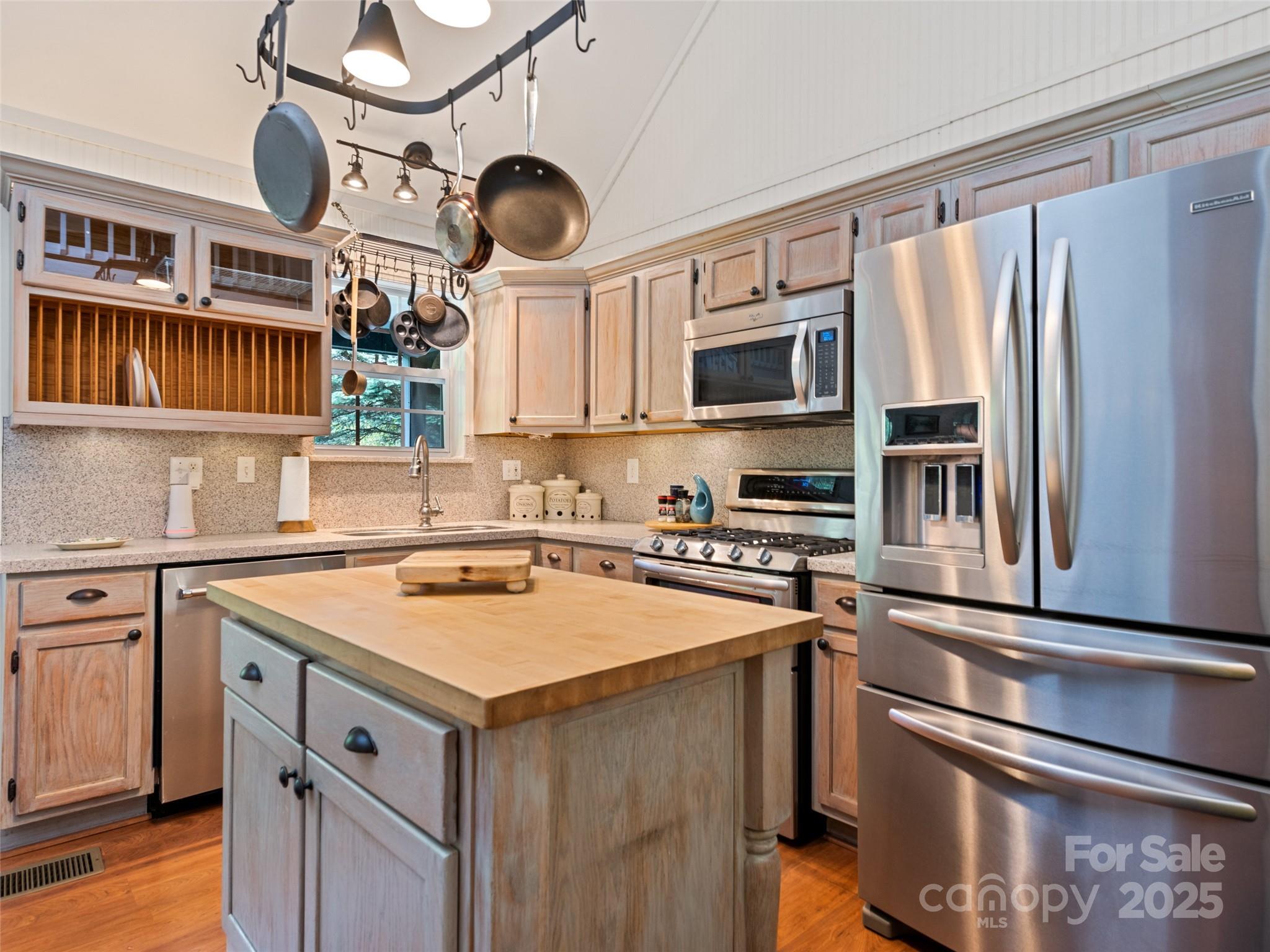 195 Three Springs Drive Sylva, NC 28779 - Photo 24 of 48 a kitchen with a stove and a microwave oven