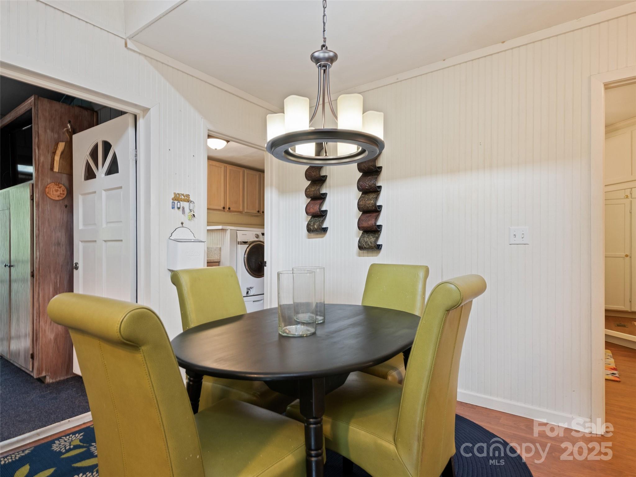 195 Three Springs Drive Sylva, NC 28779 - Photo 27 of 48 a view of a dining room with furniture and wooden floor