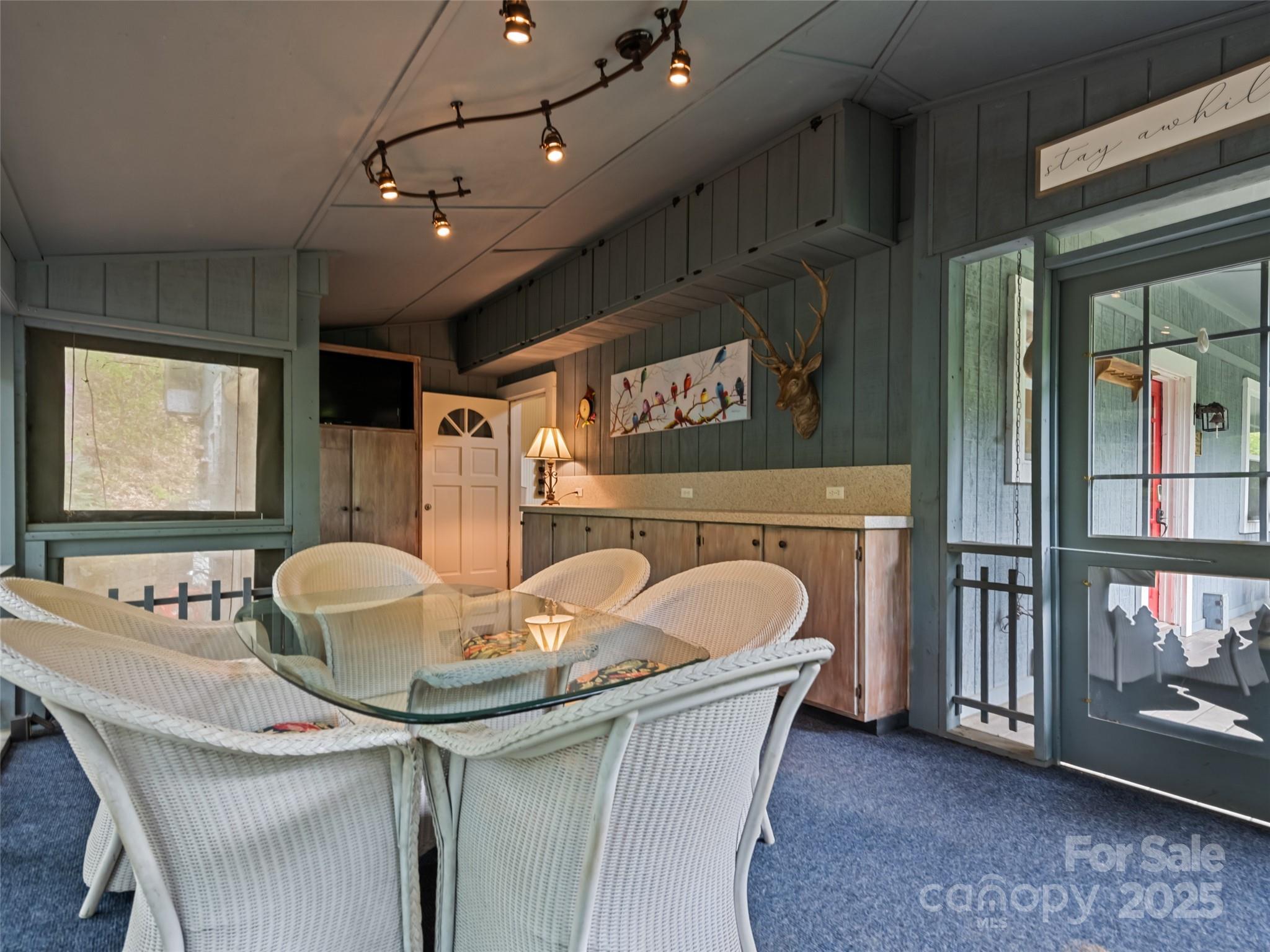 195 Three Springs Drive Sylva, NC 28779 - Photo 30 of 48 a dining room with furniture and a floor to ceiling window