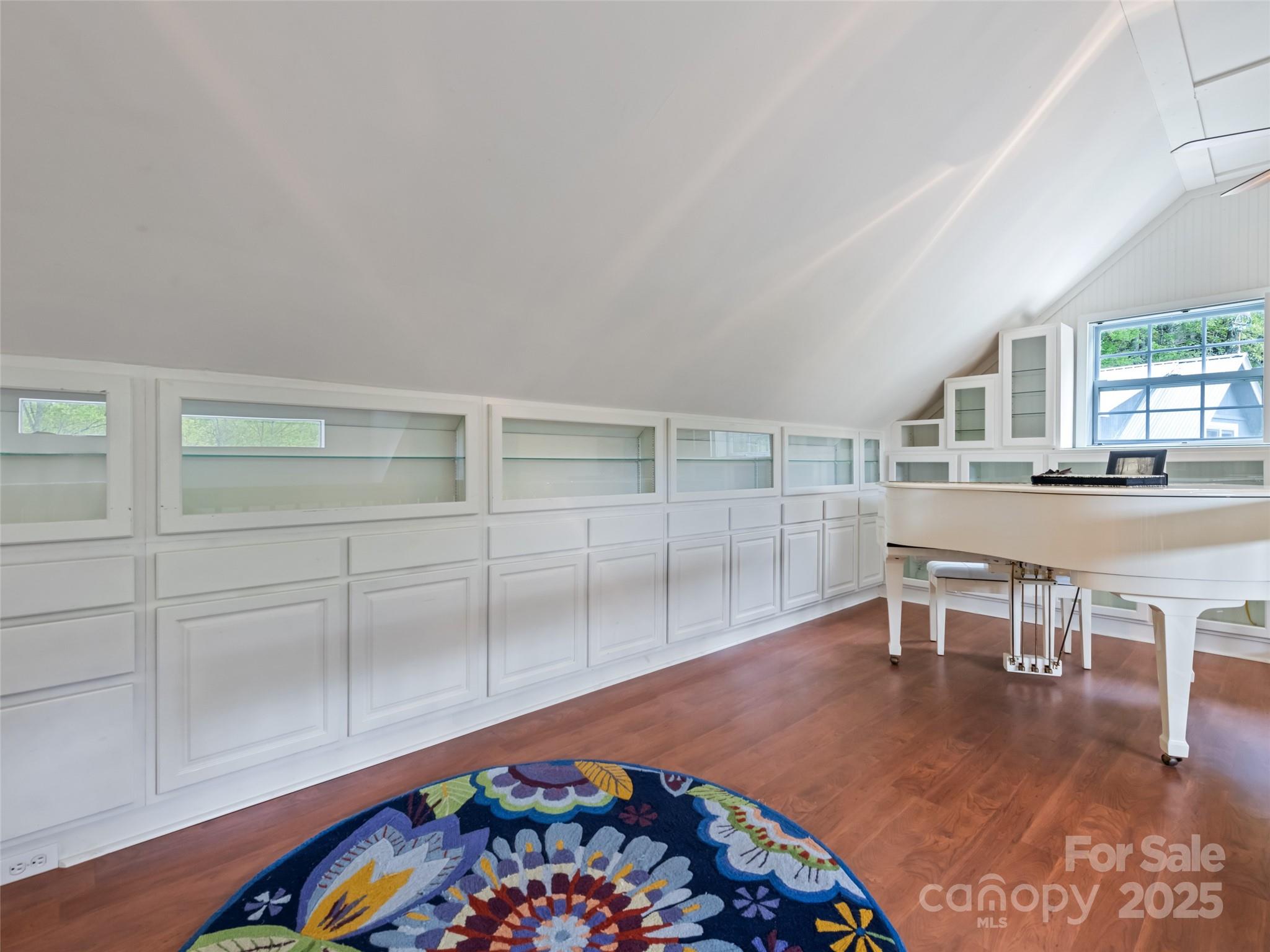 195 Three Springs Drive Sylva, NC 28779 - Photo 38 of 48 an empty room with wooden floor