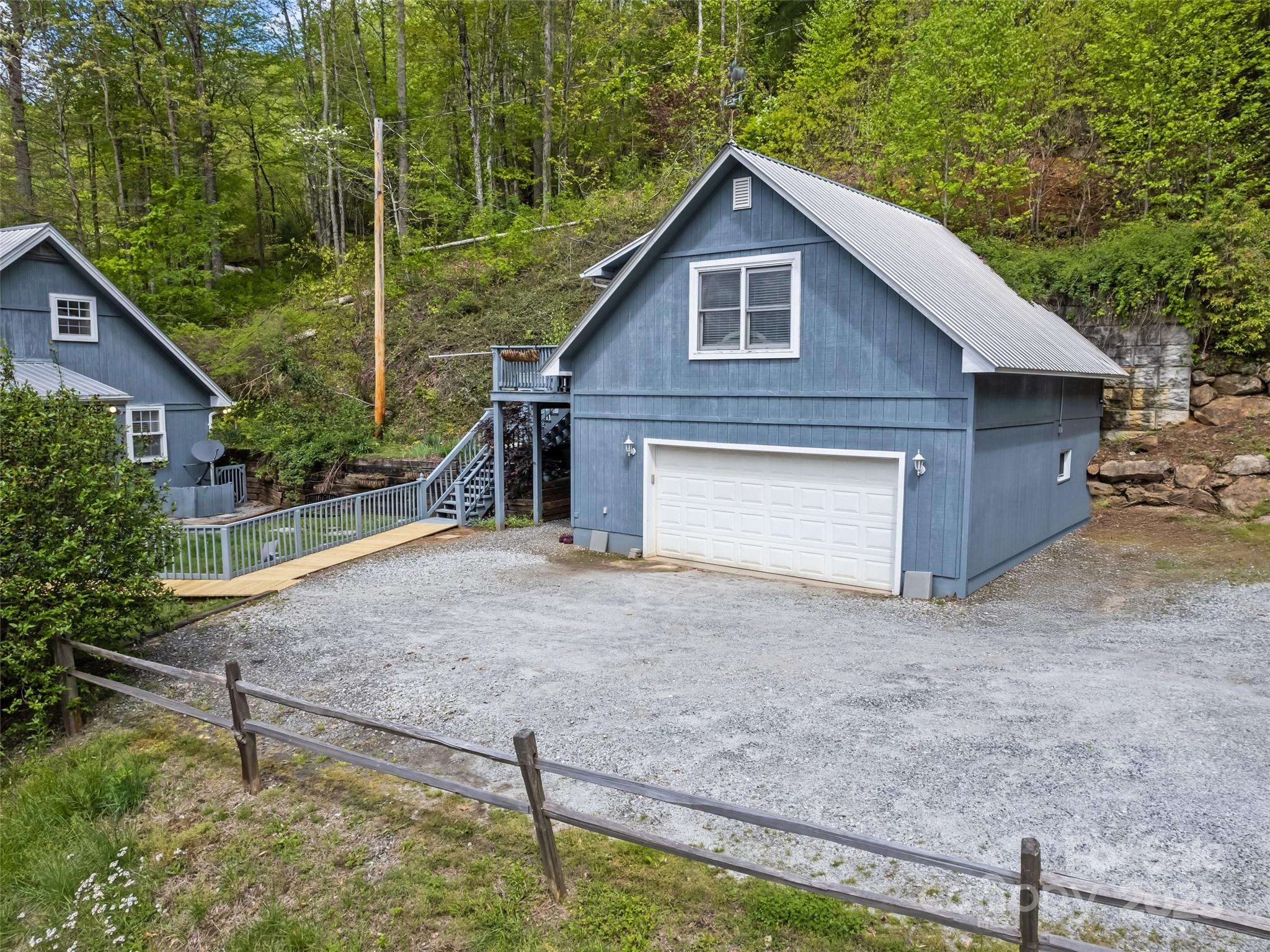 195 Three Springs Drive Sylva, NC 28779 - Photo 4 of 48 a view of backyard of house and garage